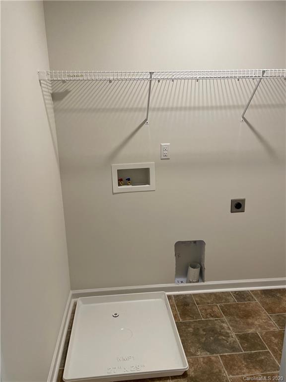 5005 Traynor Road, Unit 18 Charlotte, NC 28216 - Photo 25 of 35 a view of a room with racks on the wall