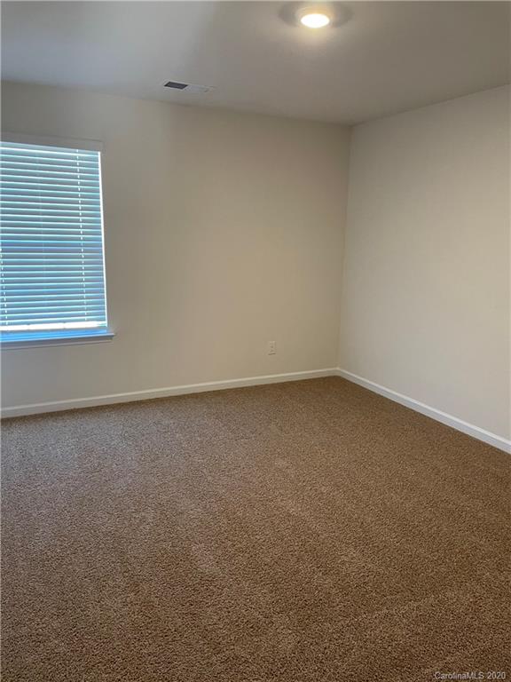 5005 Traynor Road, Unit 18 Charlotte, NC 28216 - Photo 26 of 35 an empty room with a window