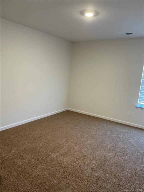 5005 Traynor Road, Unit 18 Charlotte, NC 28216 - Photo 27 of 35 a view of an empty room and a window