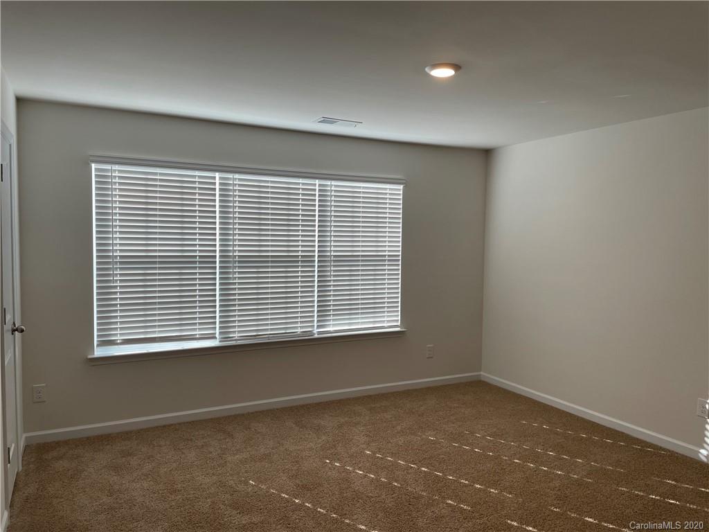 5005 Traynor Road, Unit 18 Charlotte, NC 28216 - Photo 31 of 35 a view of an empty room with a window