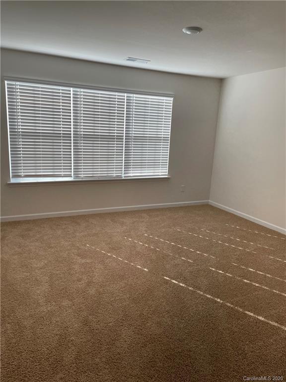 5005 Traynor Road, Unit 18 Charlotte, NC 28216 - Photo 32 of 35 an empty room with a window
