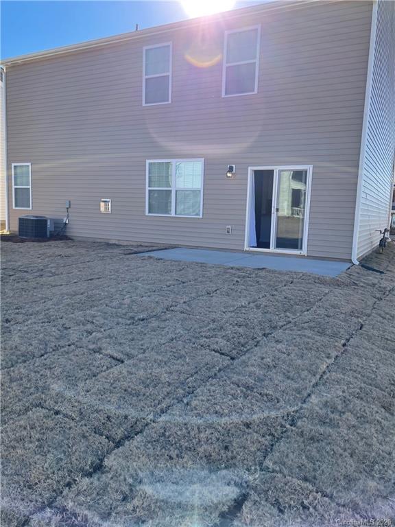 5005 Traynor Road, Unit 18 Charlotte, NC 28216 - Photo 34 of 35 a view of a house with a yard
