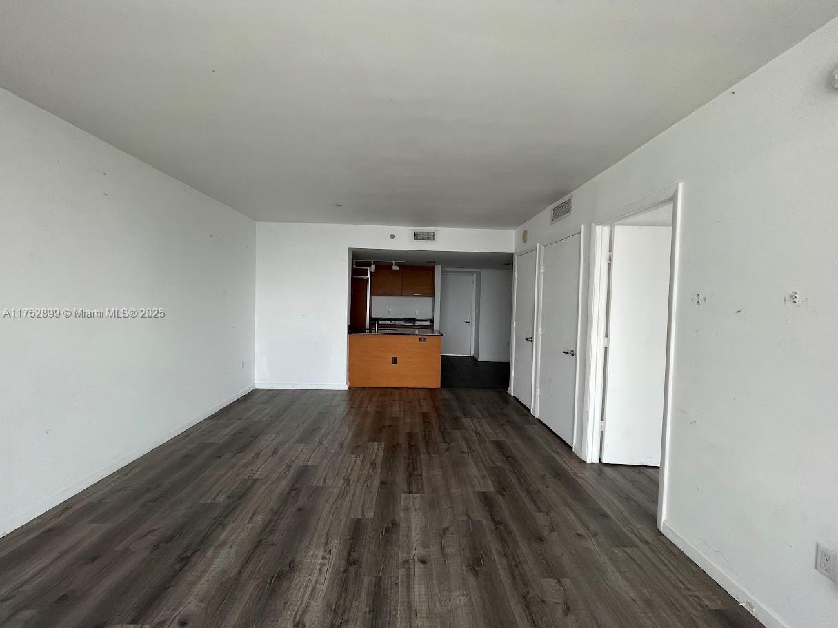 50 Biscayne Boulevard, Unit 4105 Miami, FL 33132 - Photo 32 of 41 a view of a room with wooden floor and a window