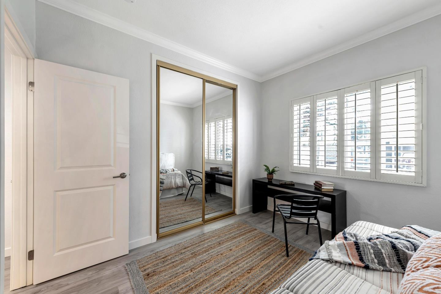 546 Shadowgraph Drive San Jose, CA 95110 - Photo 16 of 24 a bedroom with a bed and a table