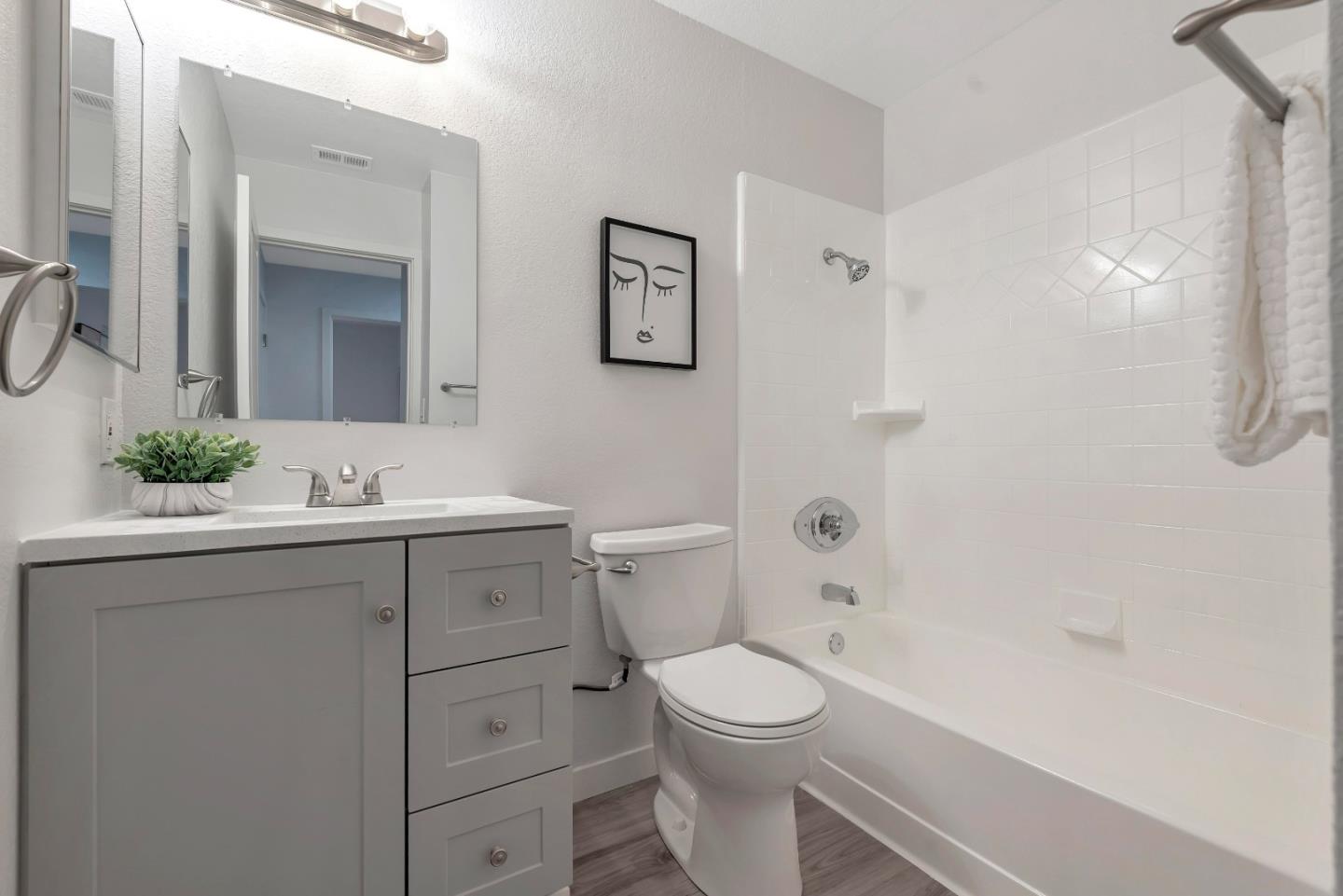 546 Shadowgraph Drive San Jose, CA 95110 - Photo 18 of 24 a bathroom with a sink a toilet and shower