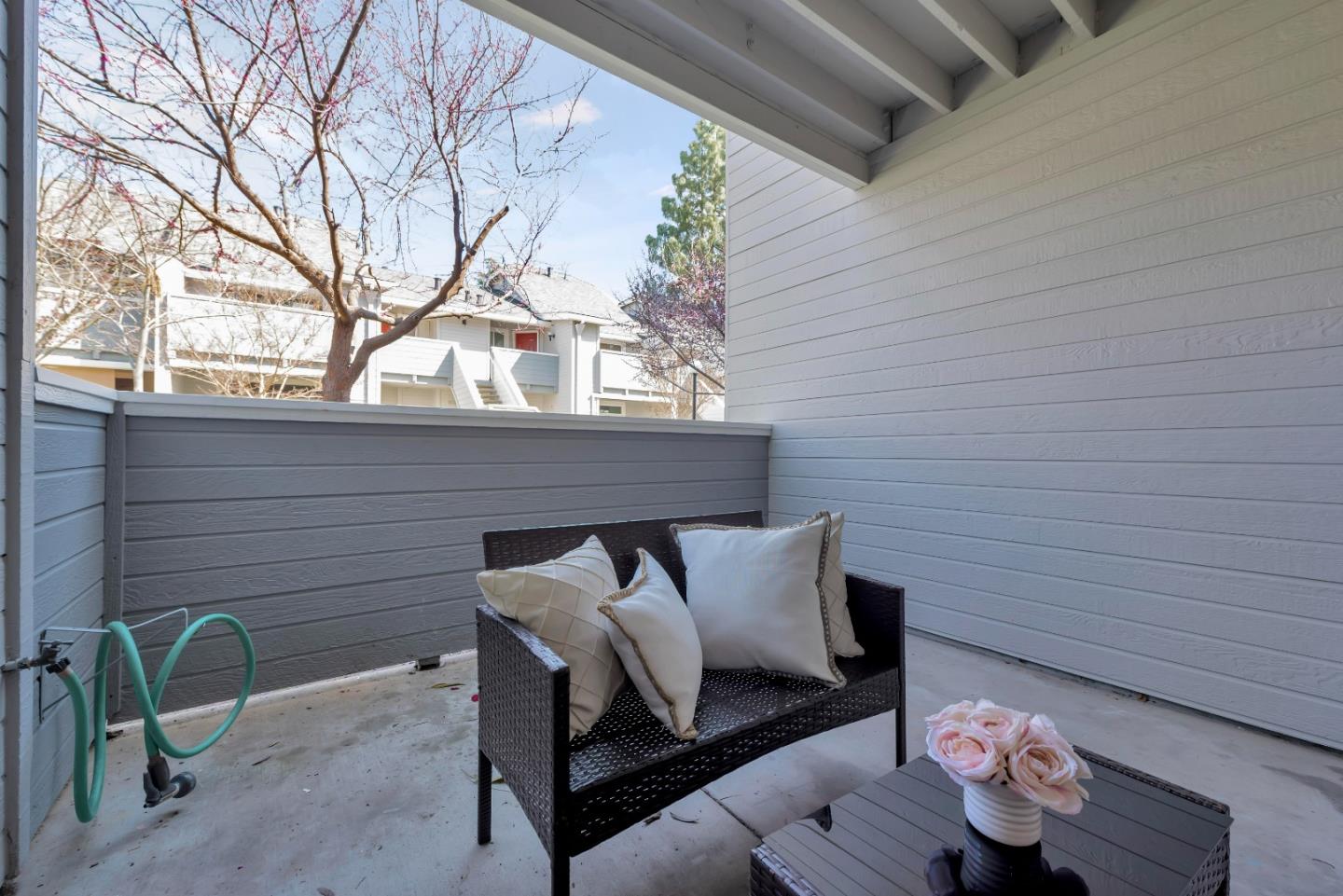 546 Shadowgraph Drive San Jose, CA 95110 - Photo 20 of 24 a wooden bench sitting in front of a building