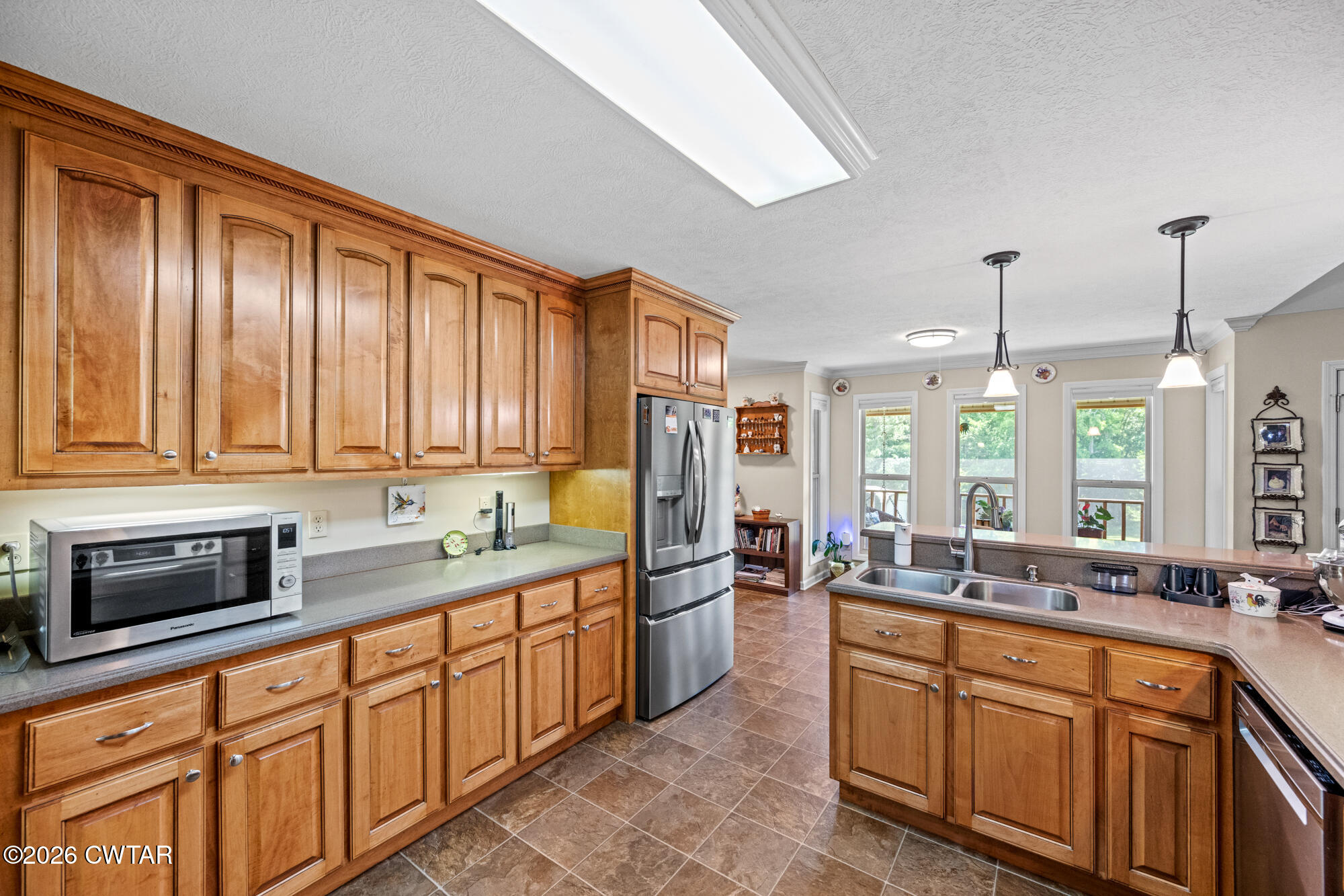 492 Joe Horton Road Lexington, TN 38351 - Photo 11 of 49 a kitchen with stainless steel appliances sink cabinets and window