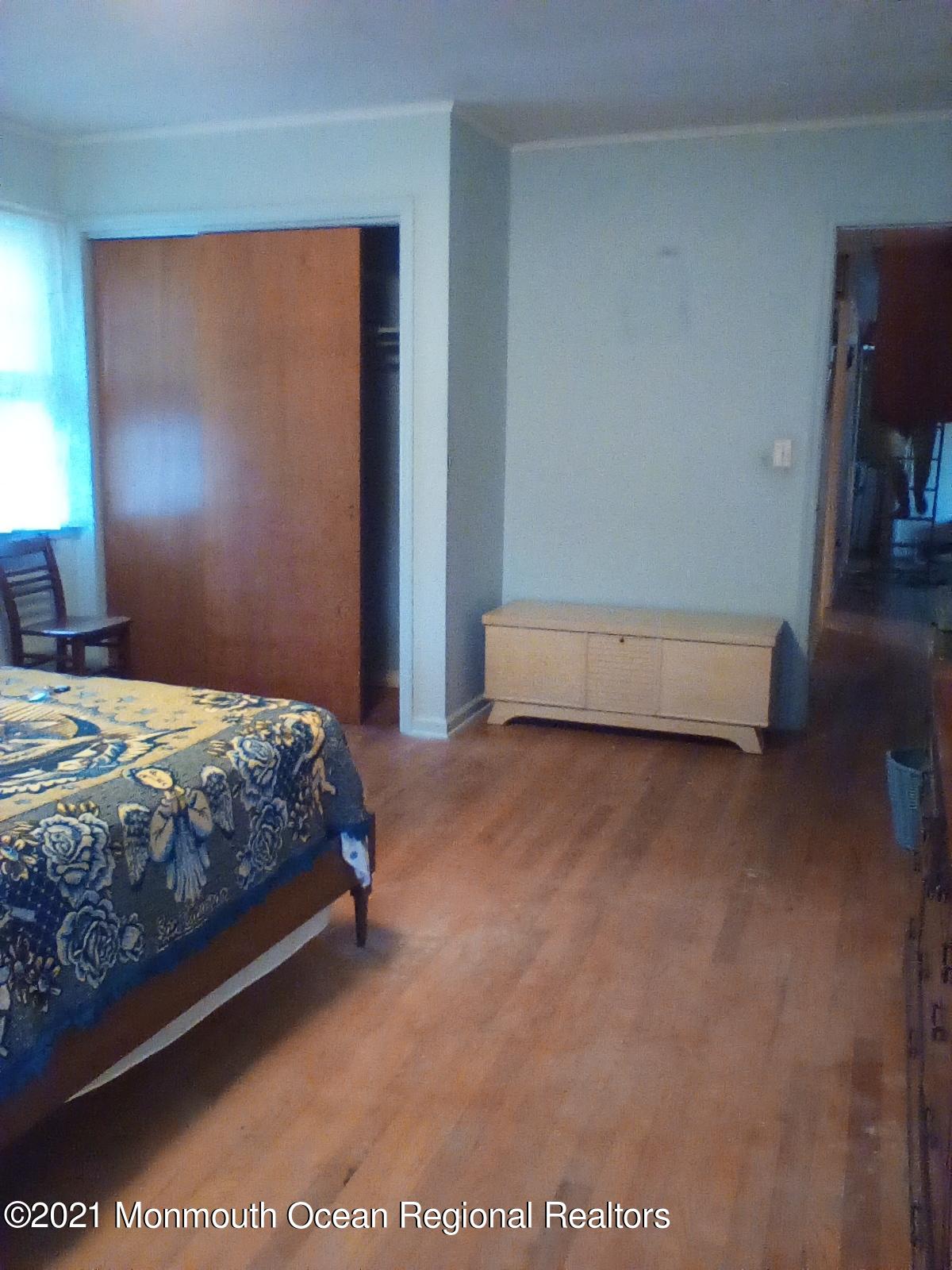 1623 Bailey Road Wall, NJ 07719 - Photo 12 of 14 a bedroom with a bed and a night stand