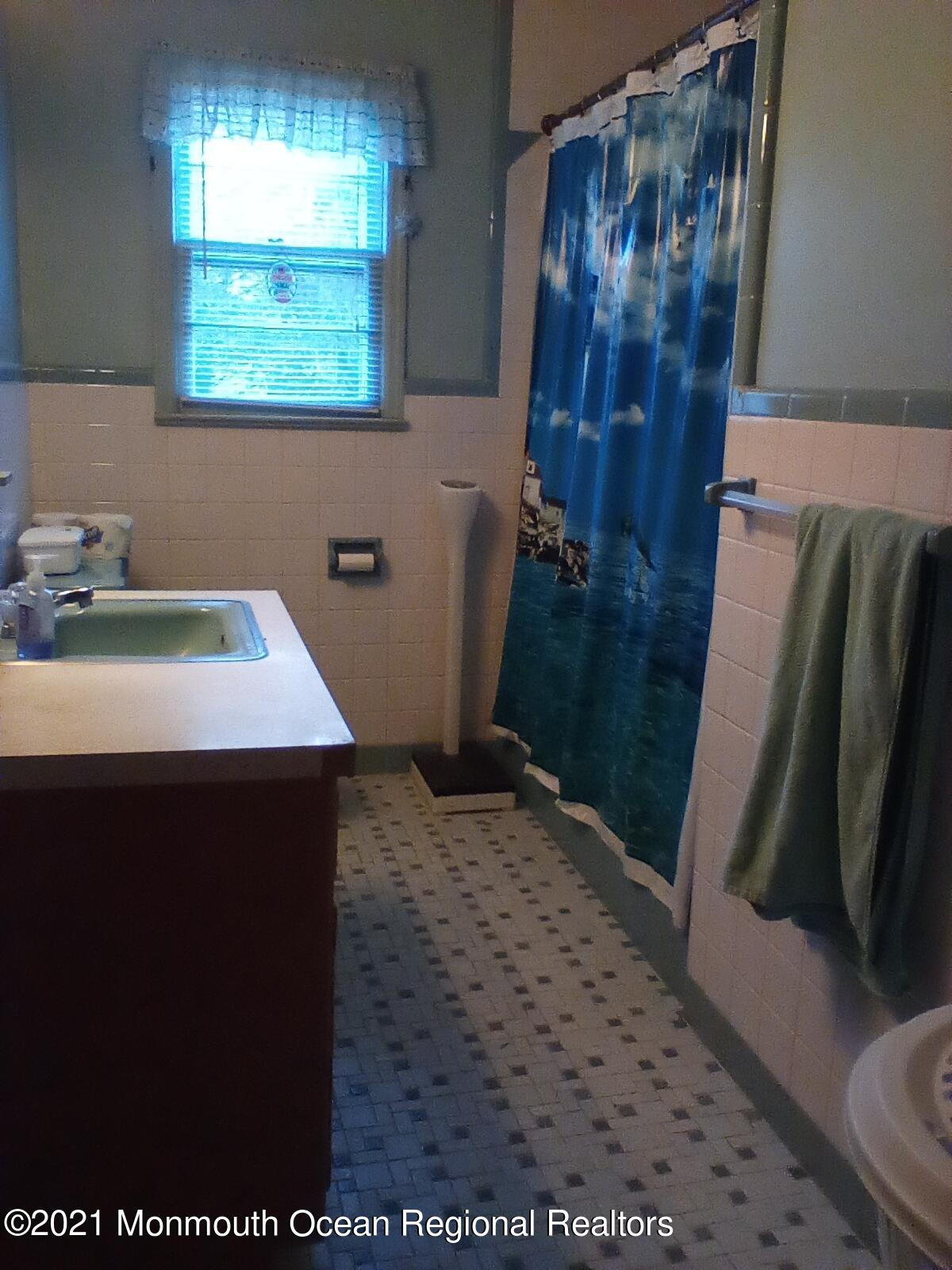 1623 Bailey Road Wall, NJ 07719 - Photo 13 of 14 a bathroom with a sink and a toilet