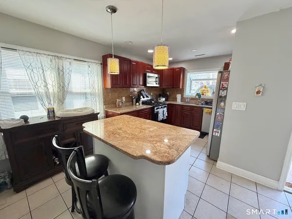 a bedroom with furniture and a wooden floor