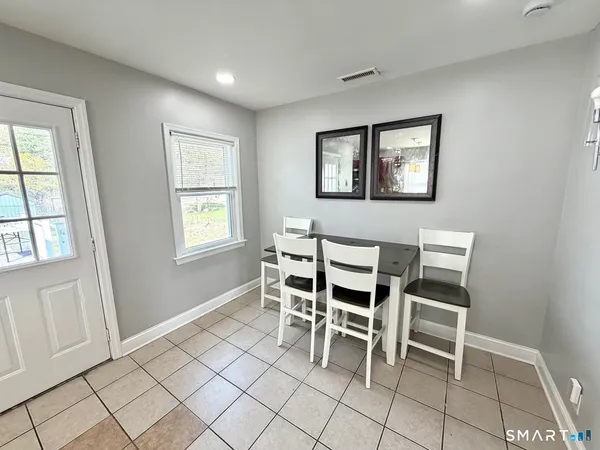a bedroom with double bed and a large window