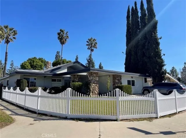 a view of a house with a porch and furniture