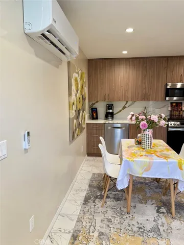 a bedroom with a bed and a chair in it