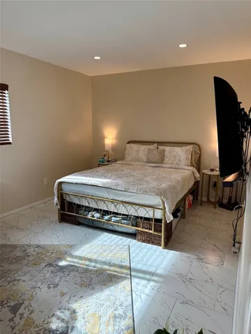 a view of a livingroom with furniture and a flat screen tv