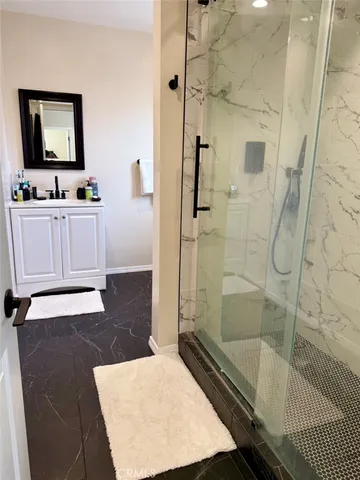 a white toilet sitting next to a bathroom sink