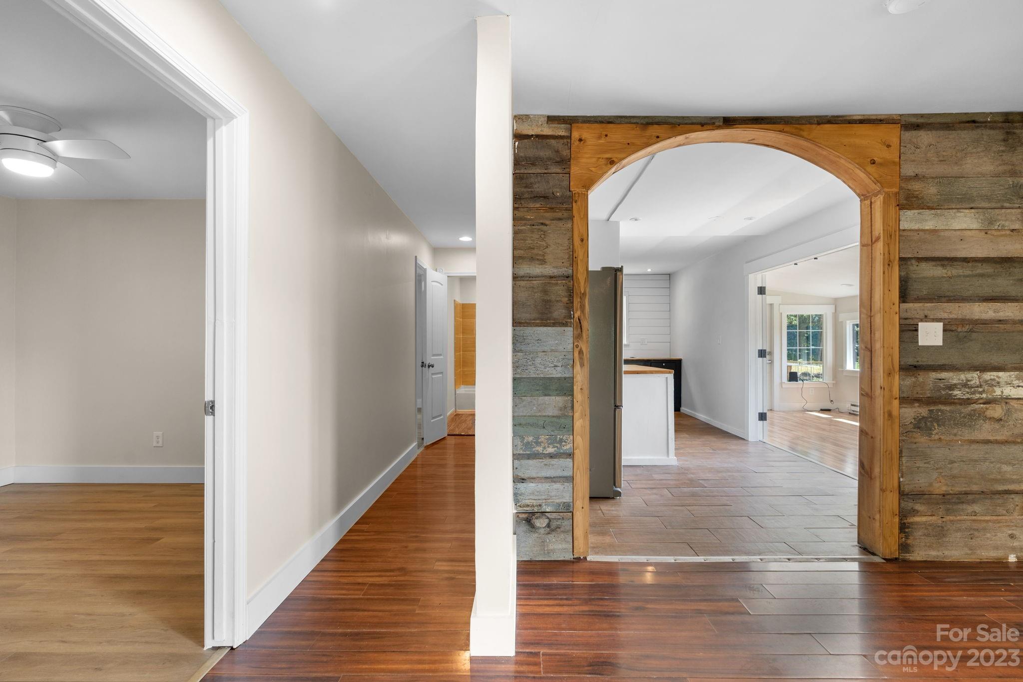632 Thunder Road Clyde, NC 28721 - Photo 12 of 41 a view of a hallway with wooden floor