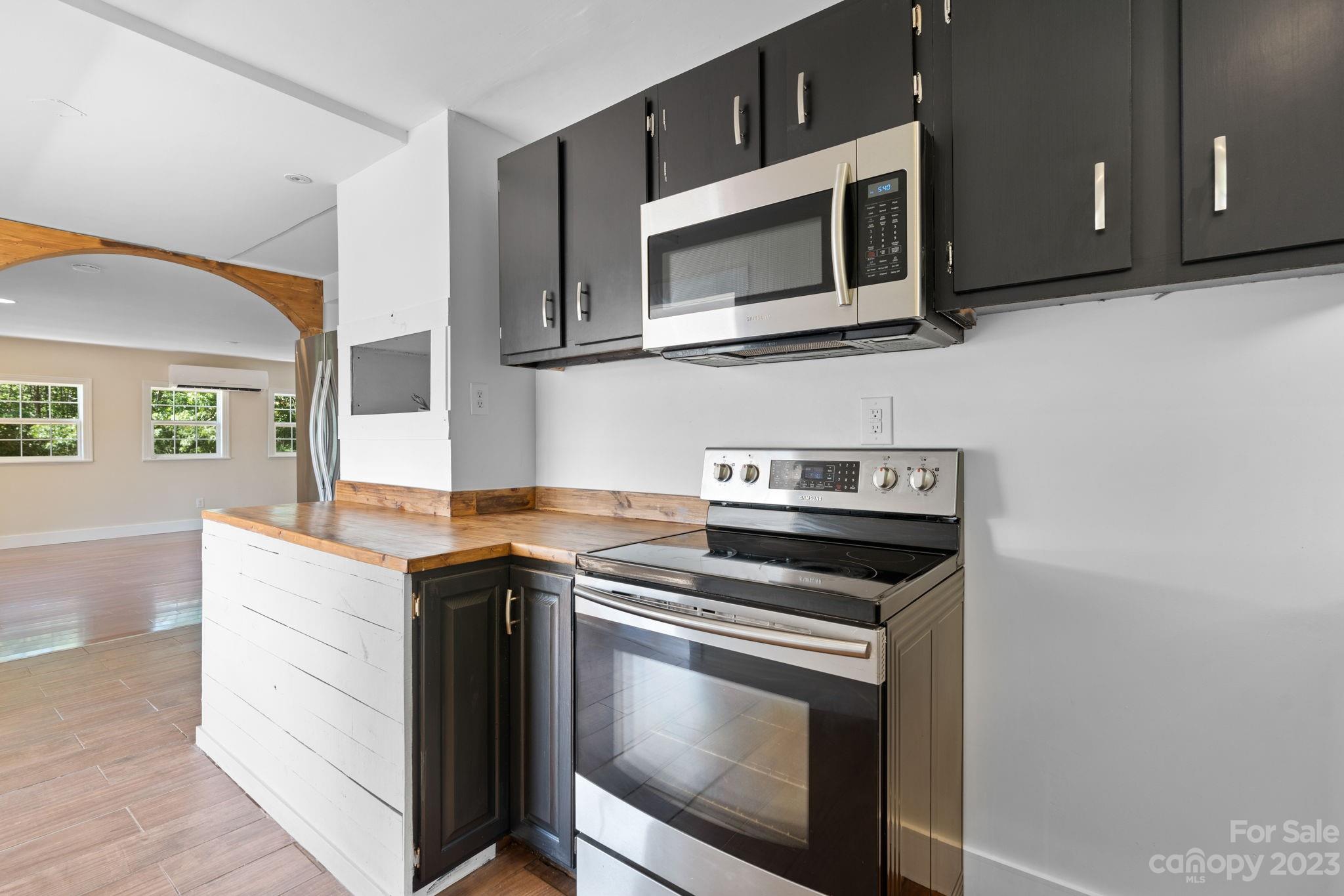 632 Thunder Road Clyde, NC 28721 - Photo 14 of 41 a kitchen with a stove and a microwave