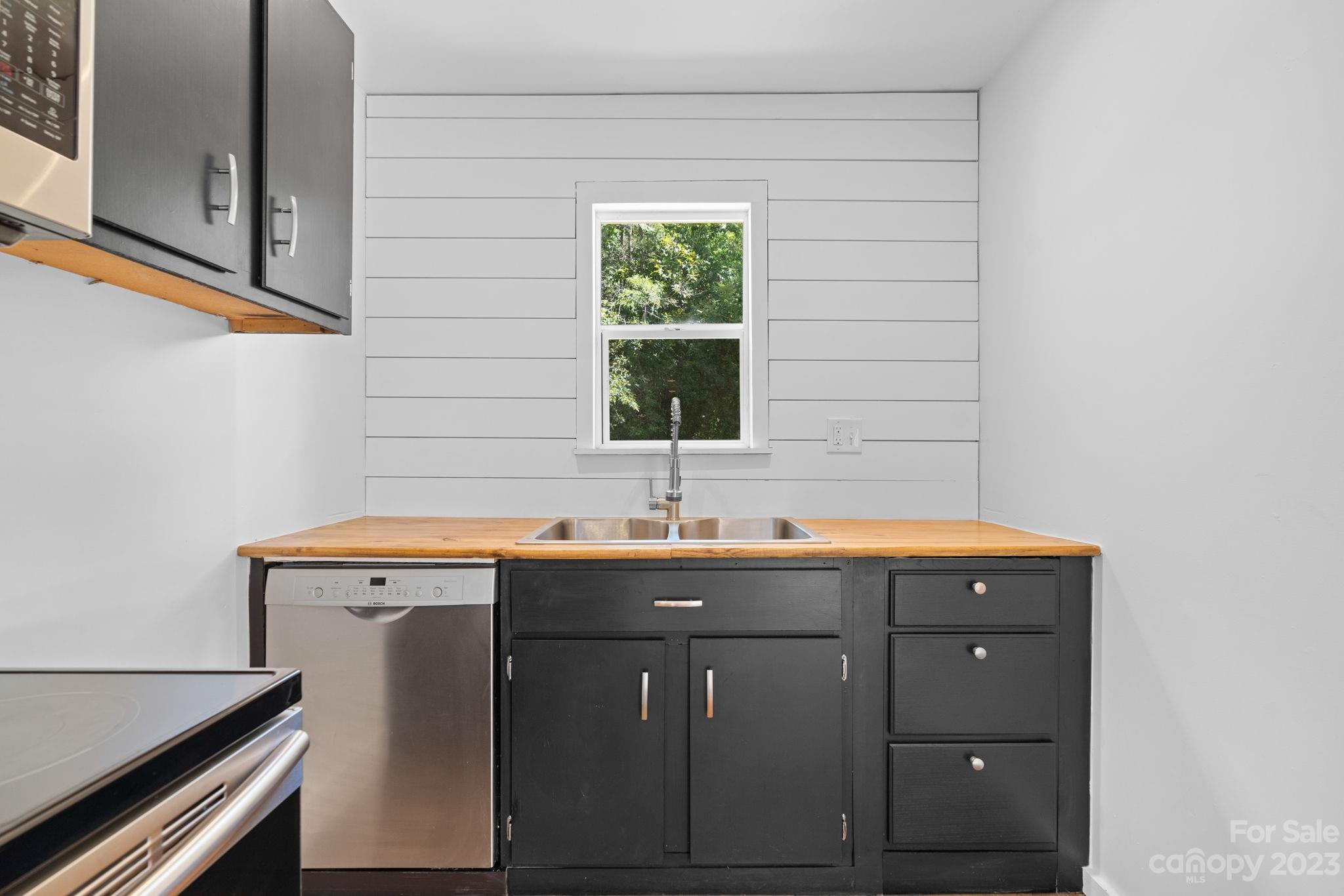 632 Thunder Road Clyde, NC 28721 - Photo 15 of 41 a utility room with a sink and a window