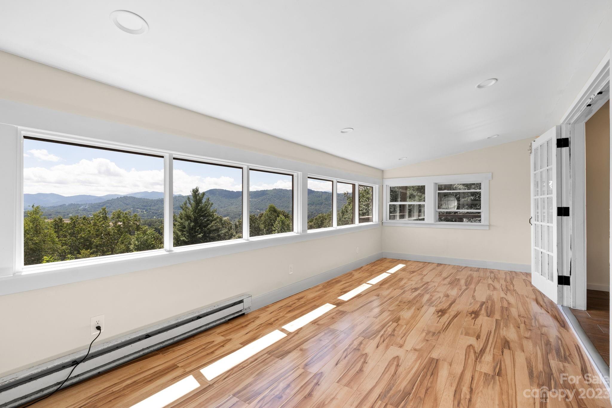 632 Thunder Road Clyde, NC 28721 - Photo 16 of 41 a view of an empty room with a window