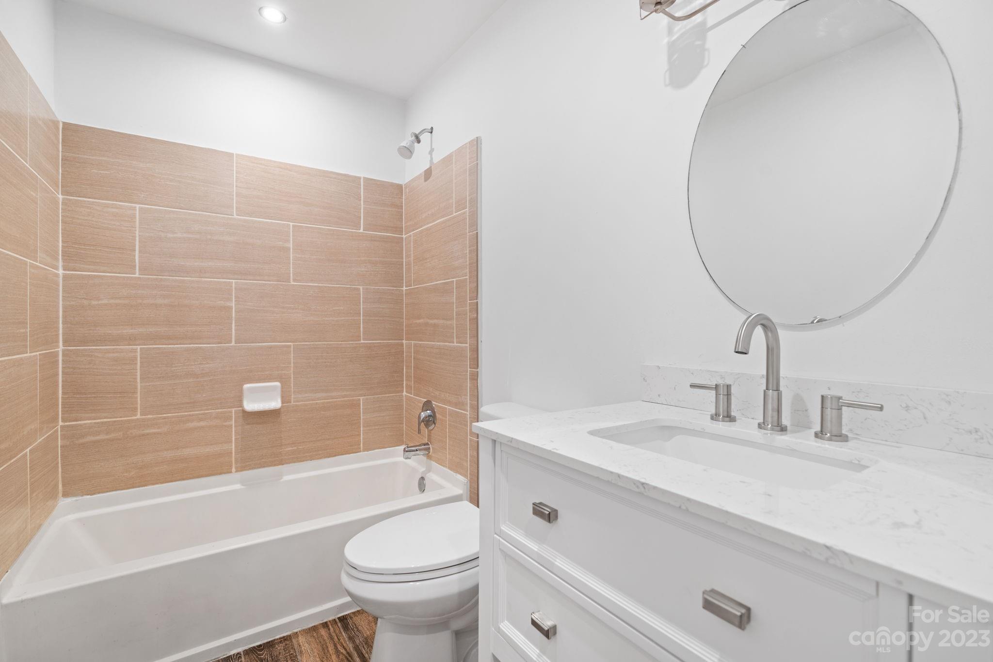 632 Thunder Road Clyde, NC 28721 - Photo 18 of 41 a bathroom with a sink toilet and shower