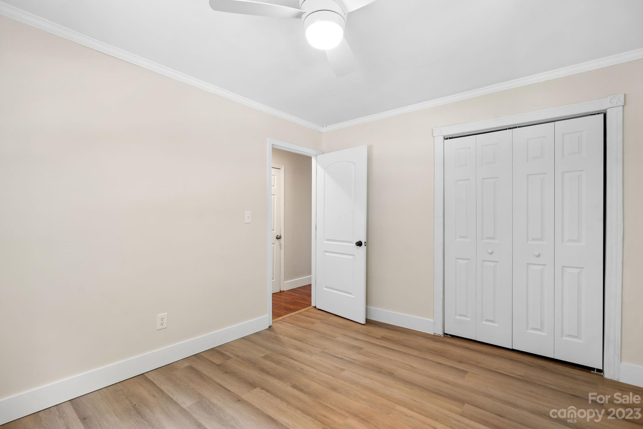 632 Thunder Road Clyde, NC 28721 - Photo 19 of 41 a view of an empty room with wooden floor