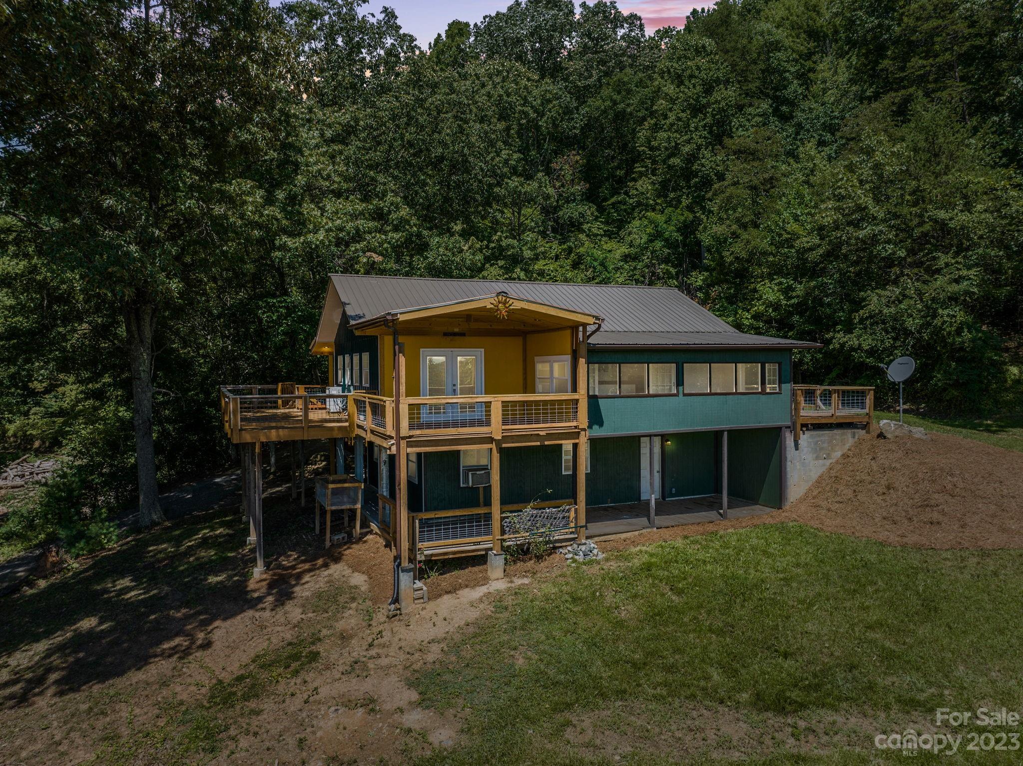 632 Thunder Road Clyde, NC 28721 - Photo 2 of 41 a front view of a house with a garden