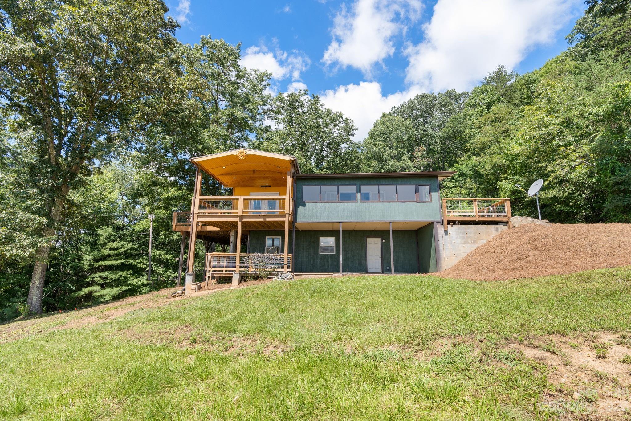 632 Thunder Road Clyde, NC 28721 - Photo 3 of 41 front view of a house with a yard