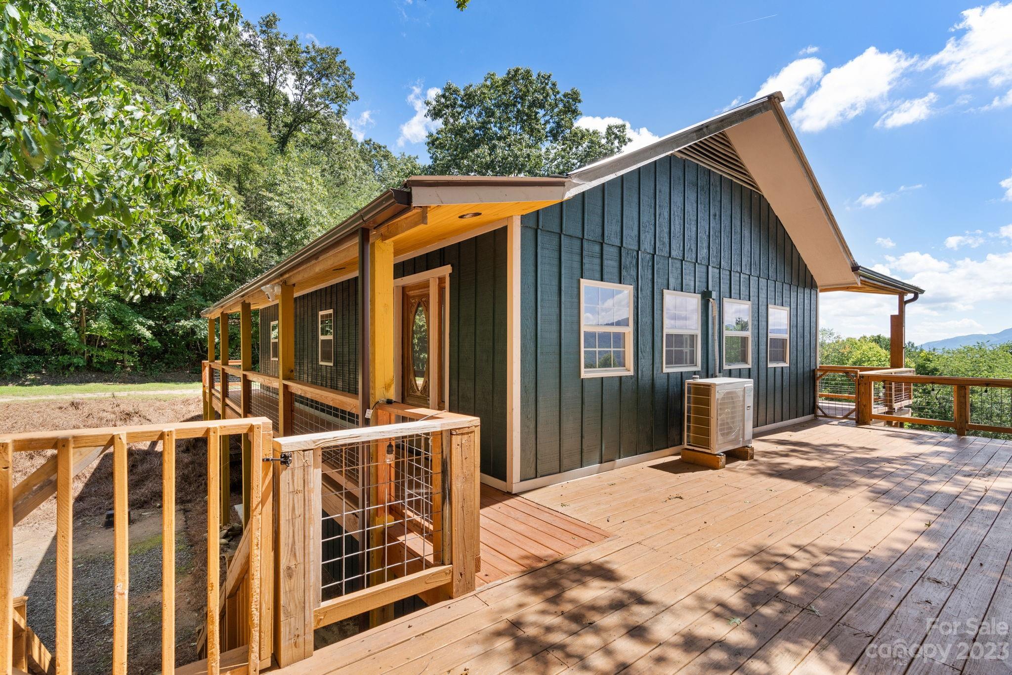 632 Thunder Road Clyde, NC 28721 - Photo 33 of 41 a view of a house with backyard and sitting area