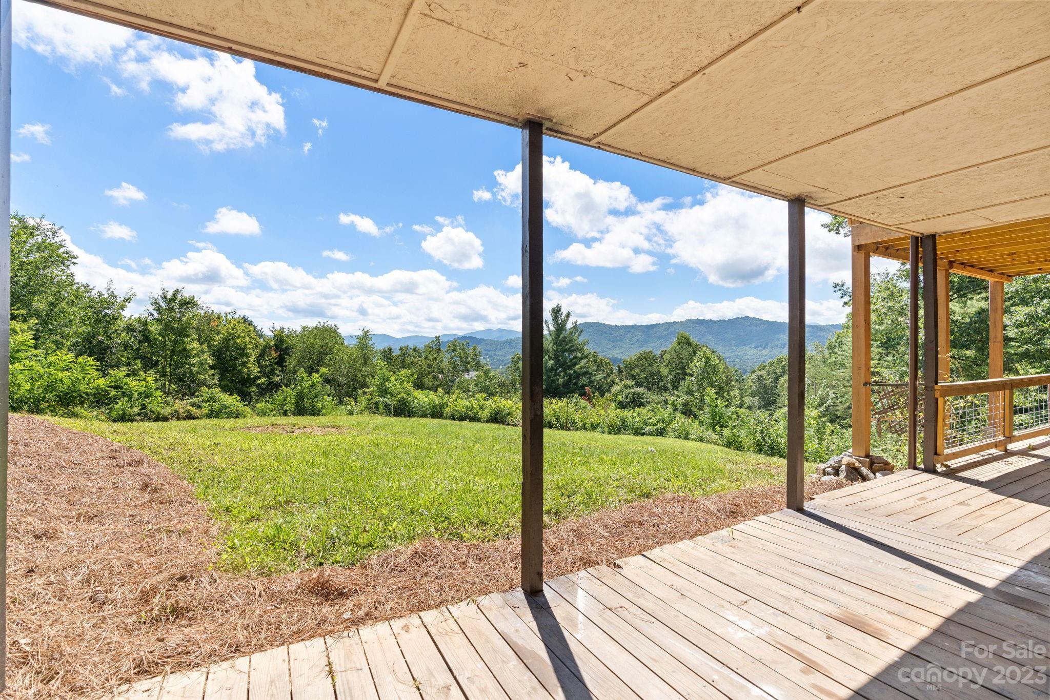 632 Thunder Road Clyde, NC 28721 - Photo 34 of 41 a view of a porch with a yard