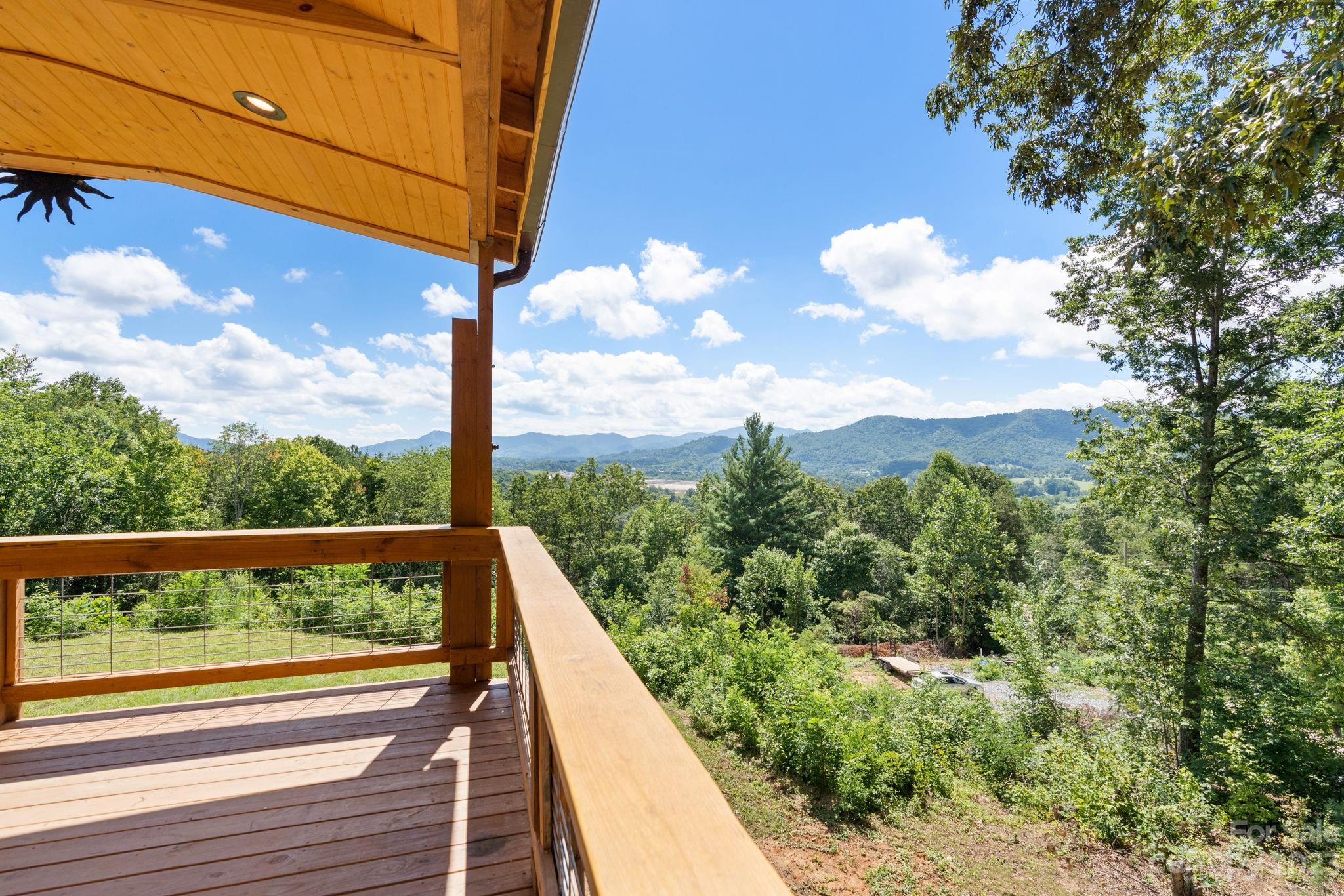 632 Thunder Road Clyde, NC 28721 - Photo 5 of 41 a view of a balcony with yard