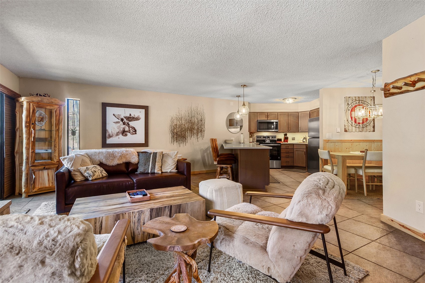 a living room with furniture and a kitchen view