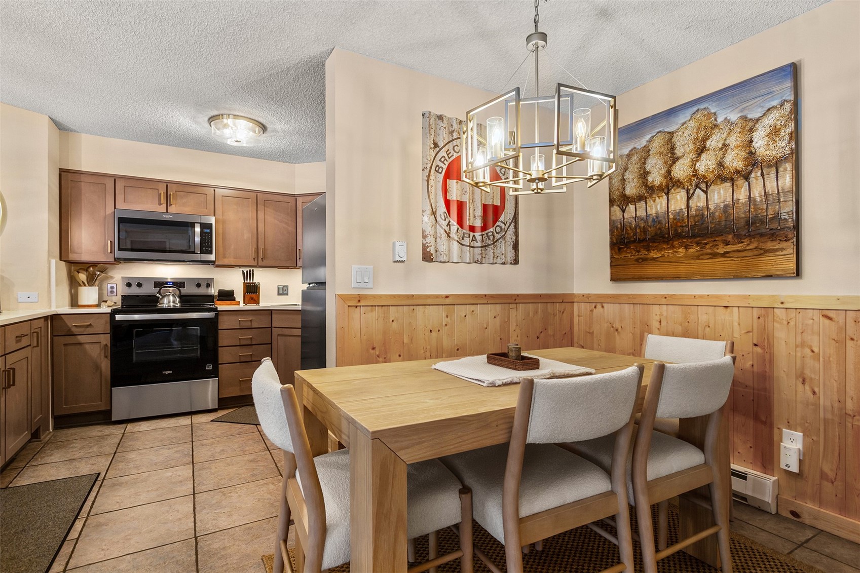 405 4 O Clock Road, Unit 15A Breckenridge, CO 80424 - Photo 11 of 50 a kitchen with a table and chairs in it