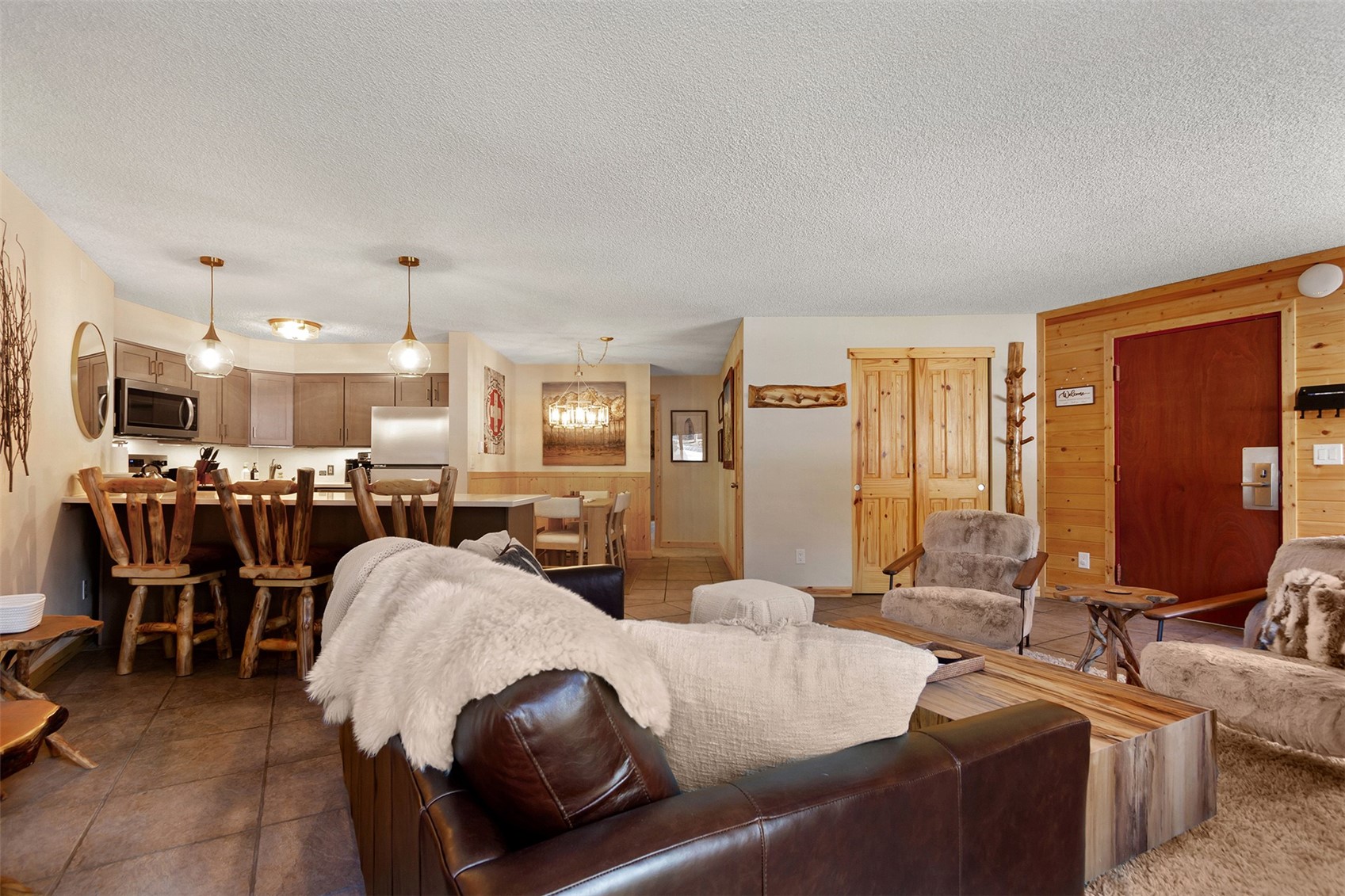 405 4 O Clock Road, Unit 15A Breckenridge, CO 80424 - Photo 16 of 50 a living room with furniture and a large window