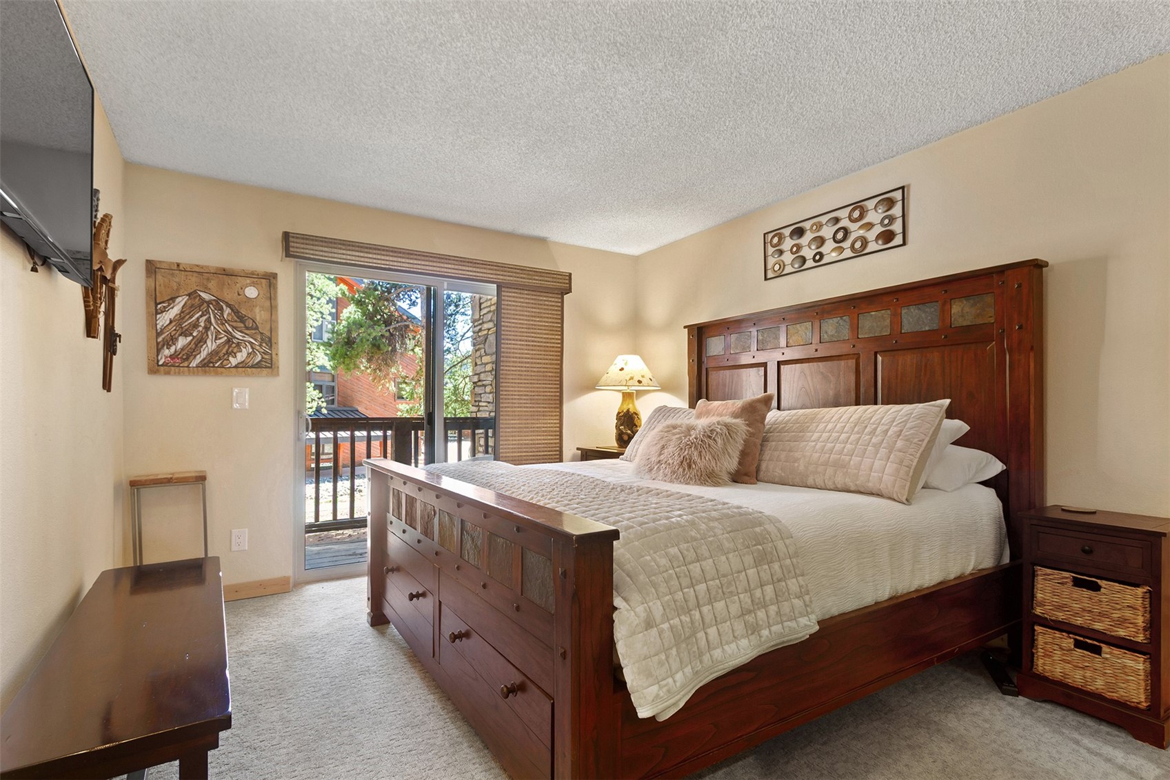 405 4 O Clock Road, Unit 15A Breckenridge, CO 80424 - Photo 23 of 50 a bedroom with a bed and a dresser next to a window