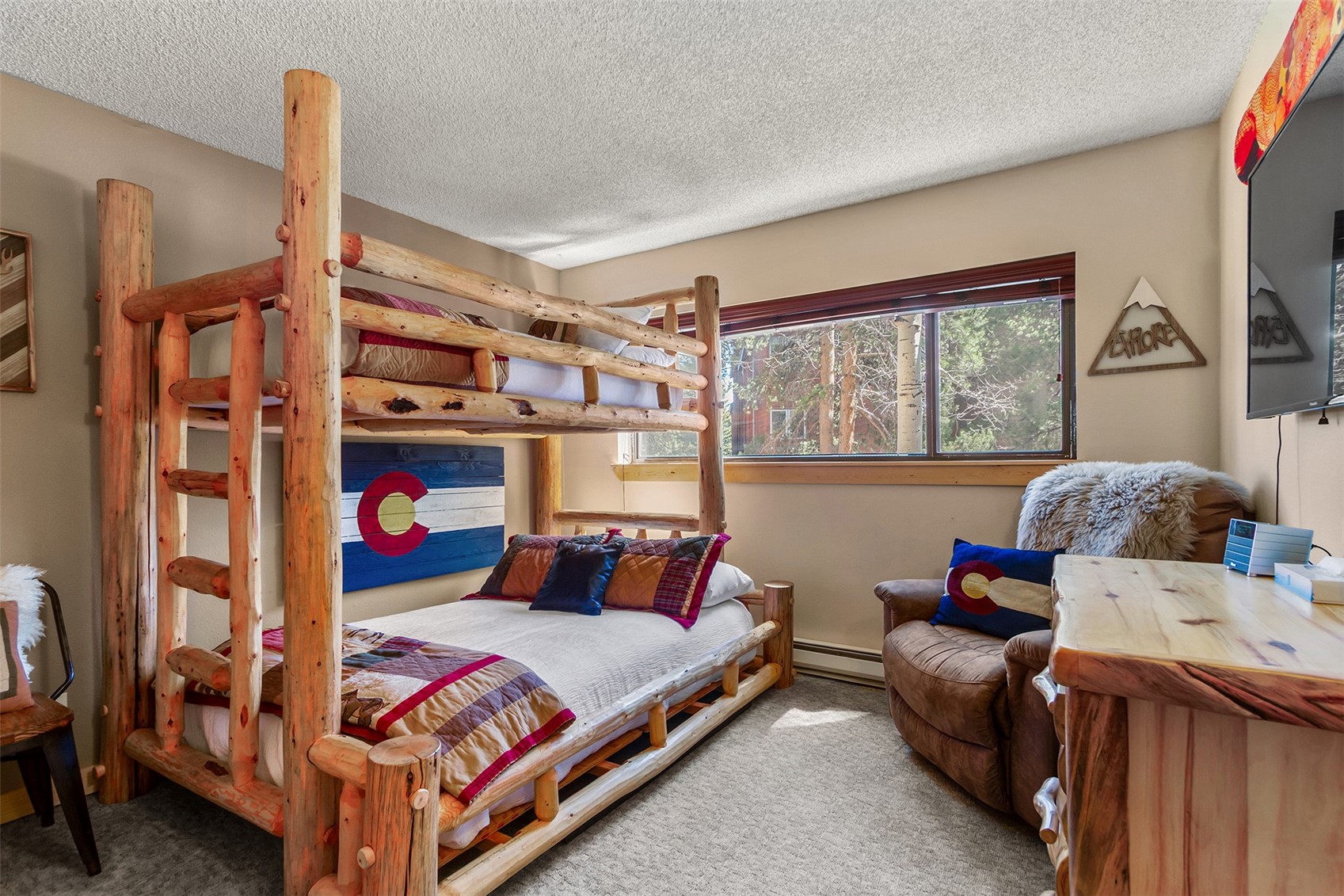 405 4 O Clock Road, Unit 15A Breckenridge, CO 80424 - Photo 29 of 50 a bedroom with furniture and a window