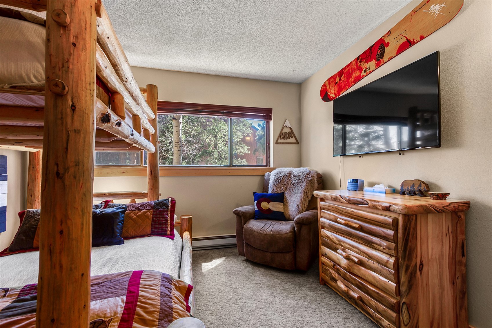 405 4 O Clock Road, Unit 15A Breckenridge, CO 80424 - Photo 30 of 50 a living room with furniture and a flat screen tv