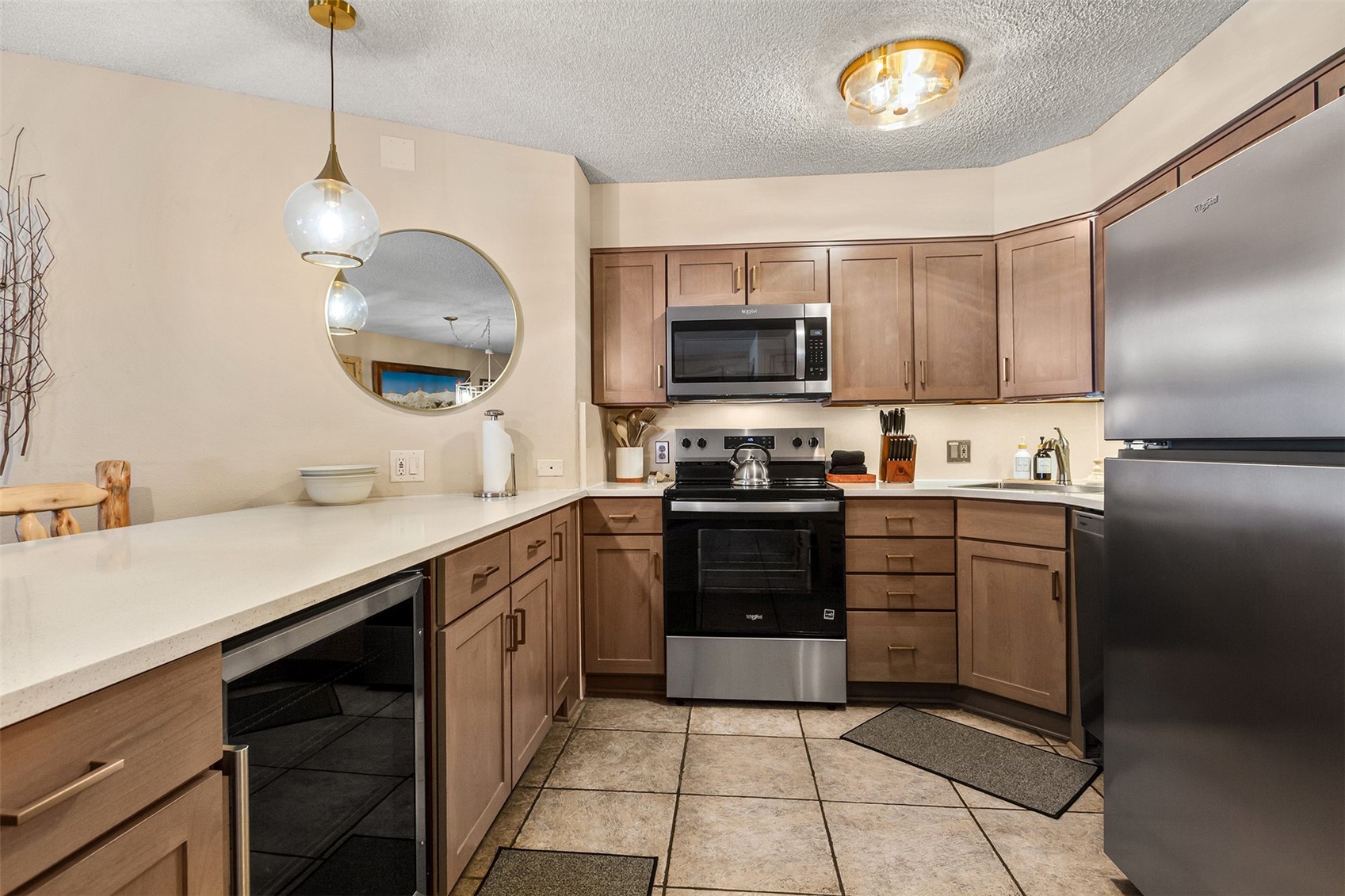 405 4 O Clock Road, Unit 15A Breckenridge, CO 80424 - Photo 3 of 50 a kitchen with kitchen island granite countertop a sink counter top space appliances and cabinets