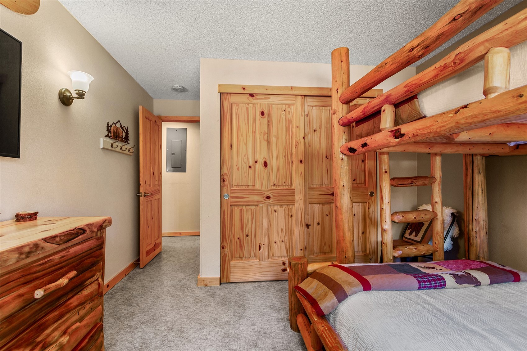 405 4 O Clock Road, Unit 15A Breckenridge, CO 80424 - Photo 31 of 50 a bedroom with a bed and a dresser