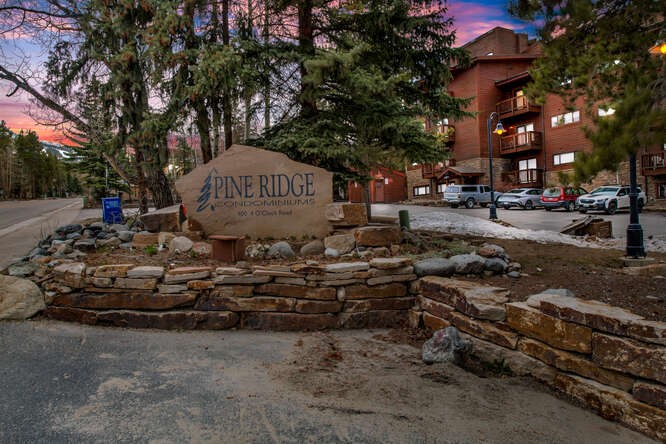 405 4 O Clock Road, Unit 15A Breckenridge, CO 80424 - Photo 36 of 50 a sign that is sitting on a brick wall