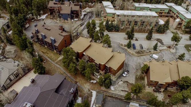 405 4 O Clock Road, Unit 15A Breckenridge, CO 80424 - Photo 44 of 50 an aerial view of a house with a yard and parking