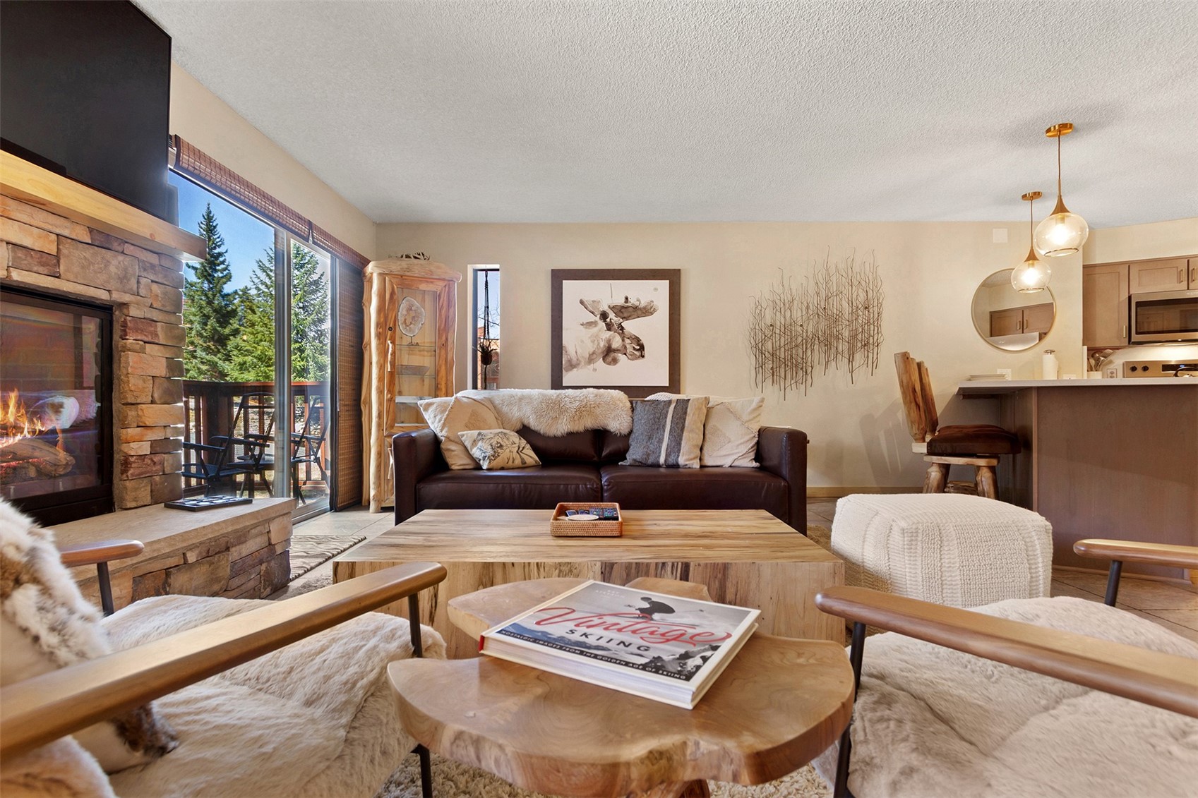 405 4 O Clock Road, Unit 15A Breckenridge, CO 80424 - Photo 9 of 50 a living room with furniture potted plant and a large window