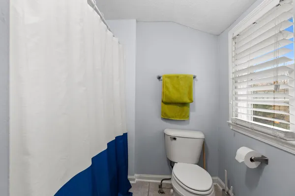 a bathroom with a toilet and a sink
