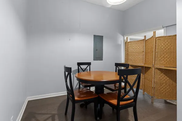 a view of a dining room with furniture and wooden floor