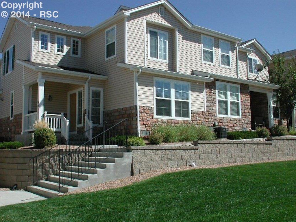 4011 Diamond Ridge View Colorado Springs, CO 80918 - Photo 1 of 17 Like Brand New! Beautiful End Unit Townhome with Covered Front Porch facing Open Space with Pikes Peak & Mountain Views from Upper Level!