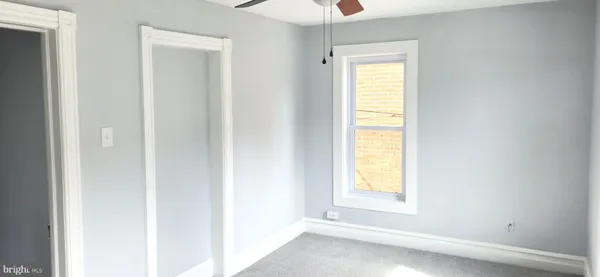 a view of empty room with windows