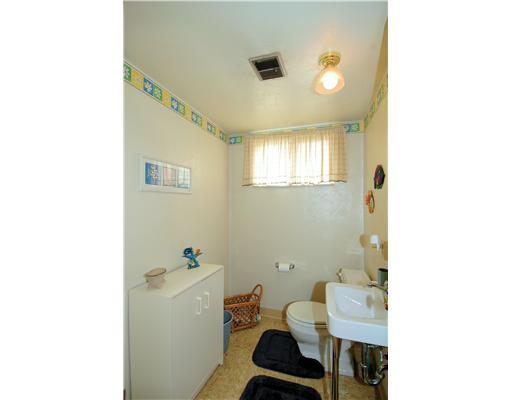 77 Fenway Road Pittsburgh, PA 15209 - Photo 14 of 17 Partial Bath. You will find a nice sized half bath perfectly placed between the levels of this spacious home. Next to this room is a large laundry featuring a door to the yard, shelving, and enough room for another refrigerator.