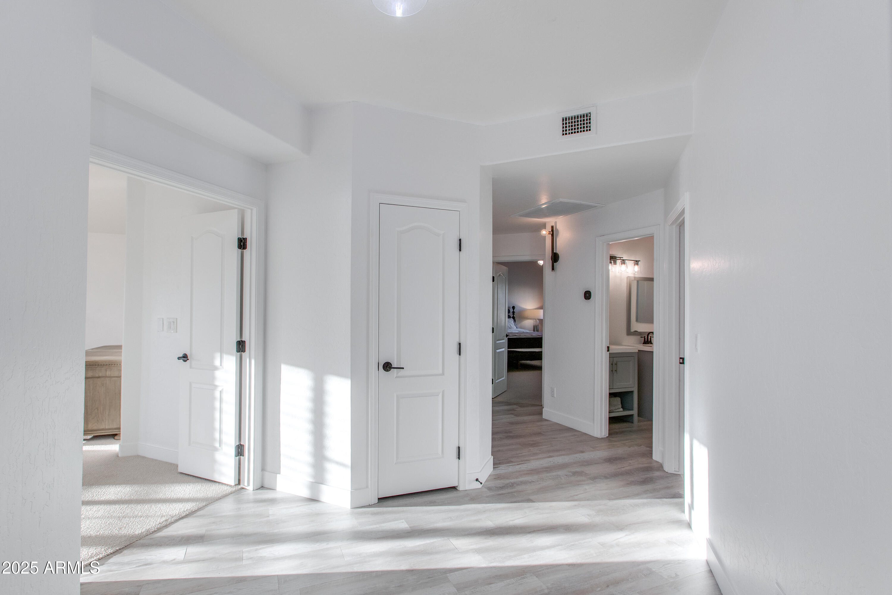 1331 East Voltaire Avenue Phoenix, AZ 85022 - Photo 12 of 33 a view of a hallway with two rooms