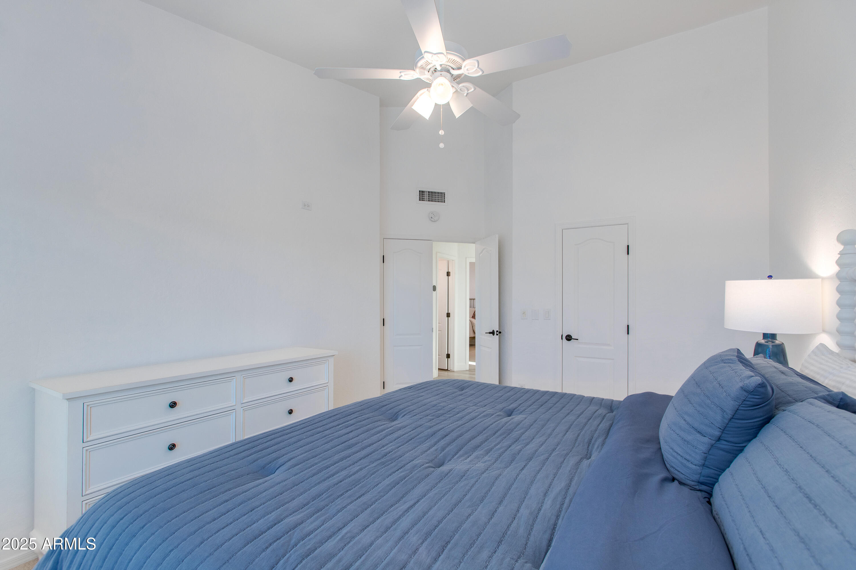 1331 East Voltaire Avenue Phoenix, AZ 85022 - Photo 20 of 33 a bedroom with a bed and a ceiling fan