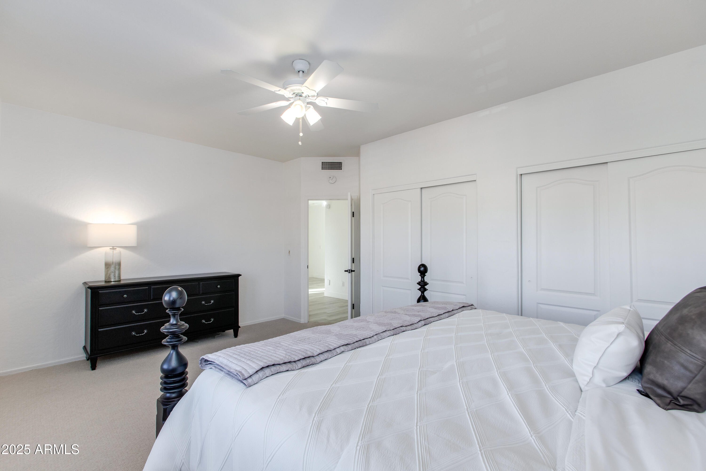1331 East Voltaire Avenue Phoenix, AZ 85022 - Photo 24 of 33 a bedroom with a bed and a chandelier