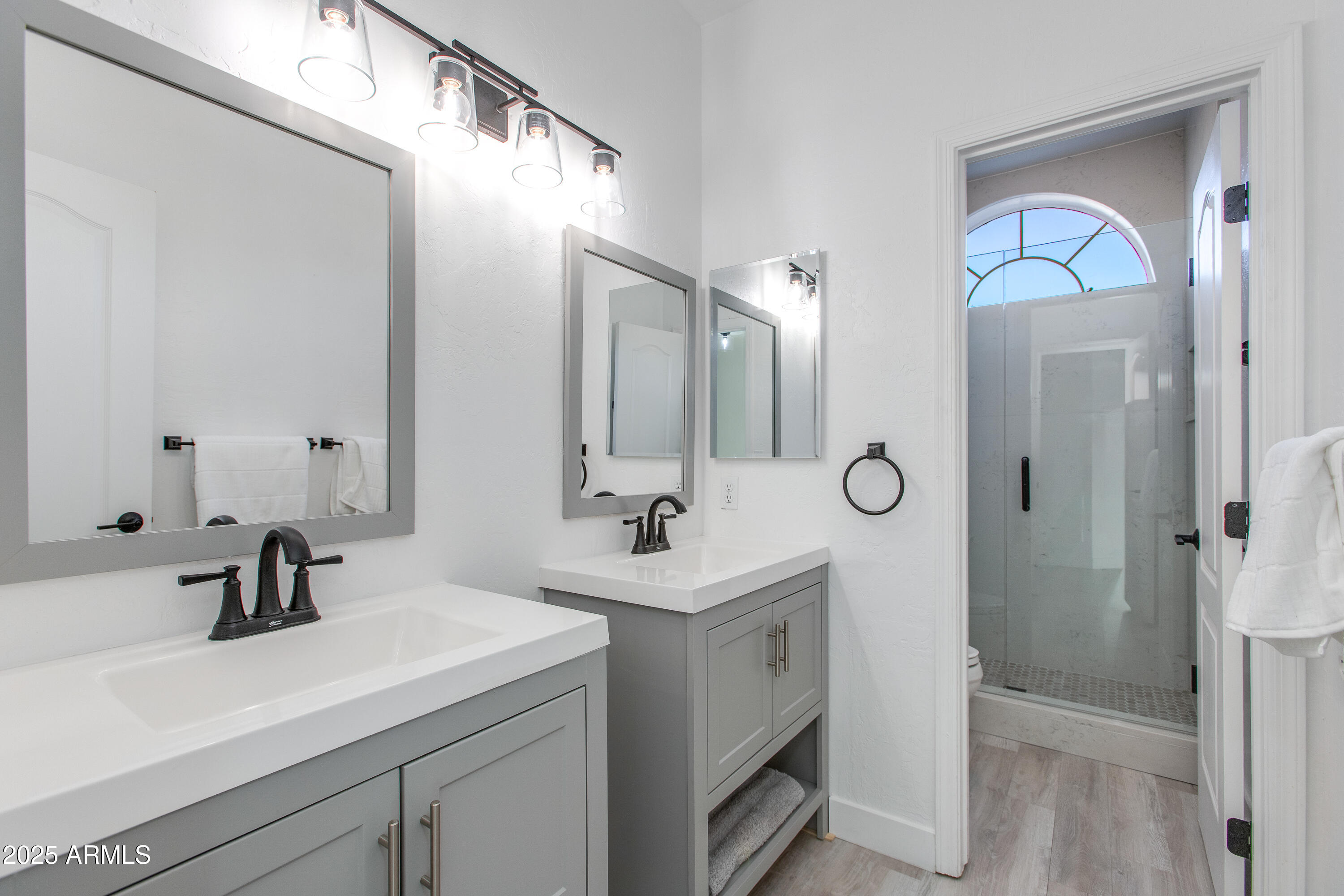1331 East Voltaire Avenue Phoenix, AZ 85022 - Photo 25 of 33 a bathroom with a sink and a mirror